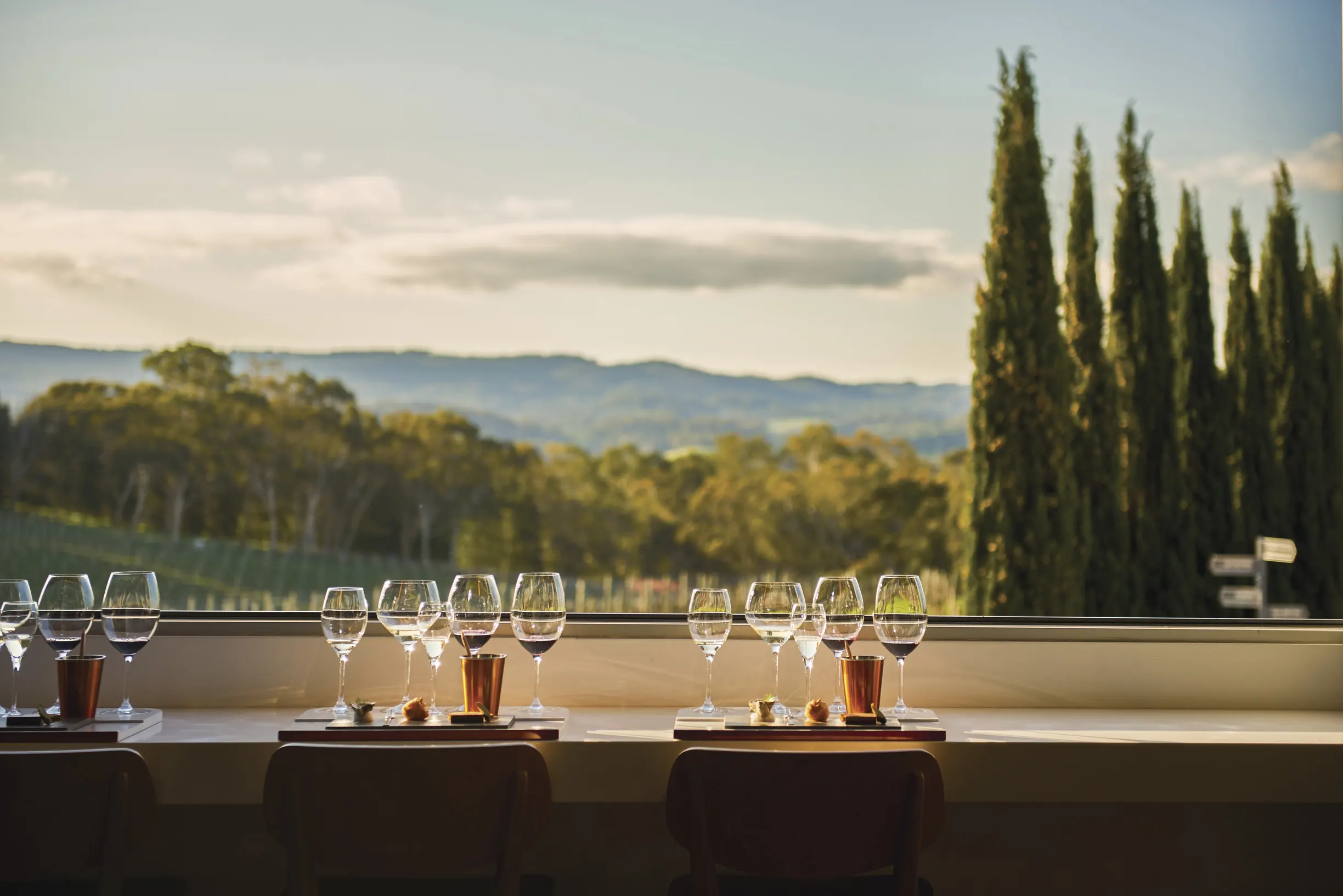 Three settings for winetasting overlooking Adelaide Hills scenery at The Lane