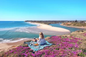 Lone picnicker looking over the Onkaparinga River Mouth in South Australia