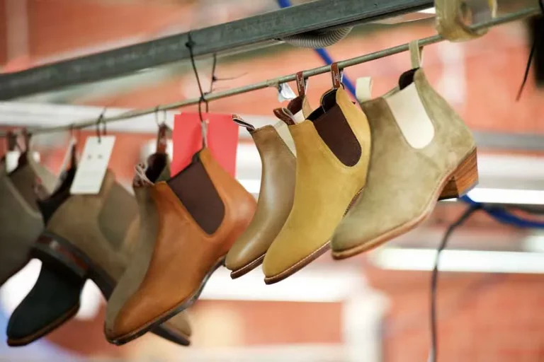 Hanging row of R.M.Williams Craftsman boots in different leathers and colours