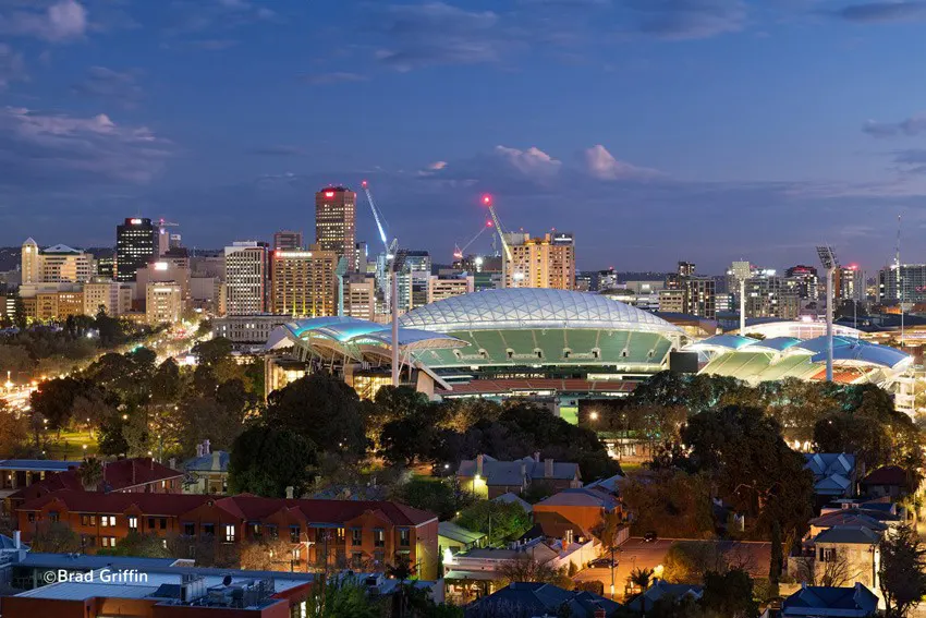 Adelaide Oval and Adelaide City skyline illuminated at dusk