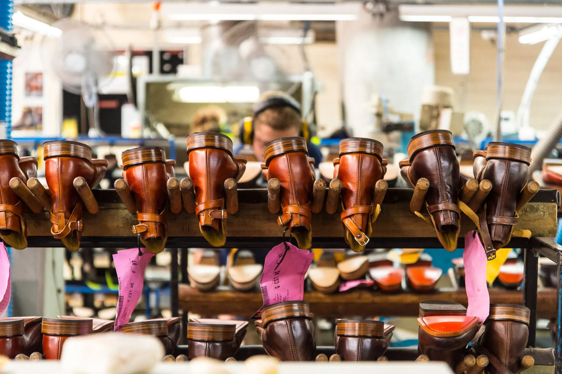 Row of R.M.Williams boots being maintained in the workshop