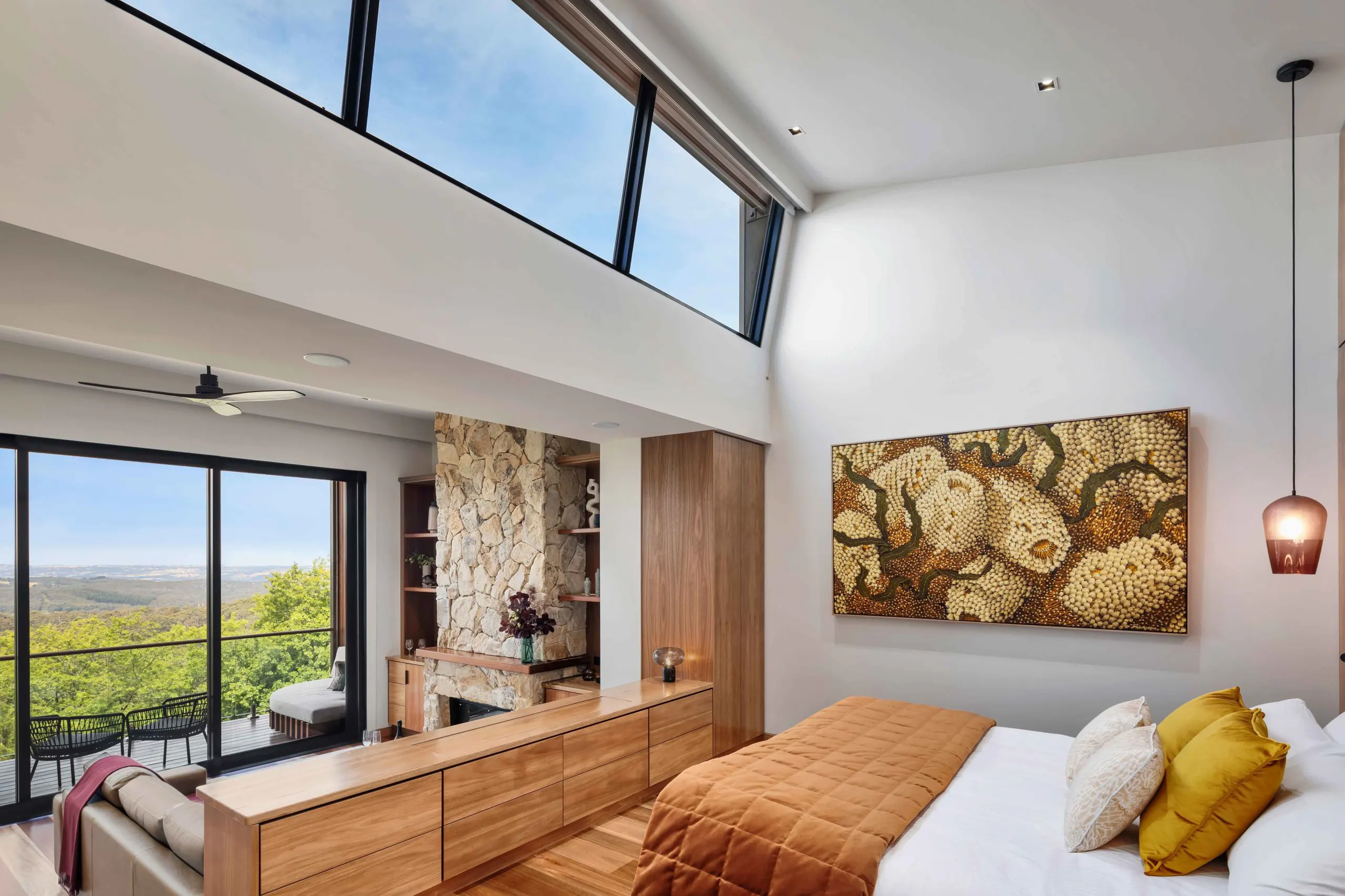 Open plan bedroom in a Sequoia Lodge suite with views to the Adelaide Hills